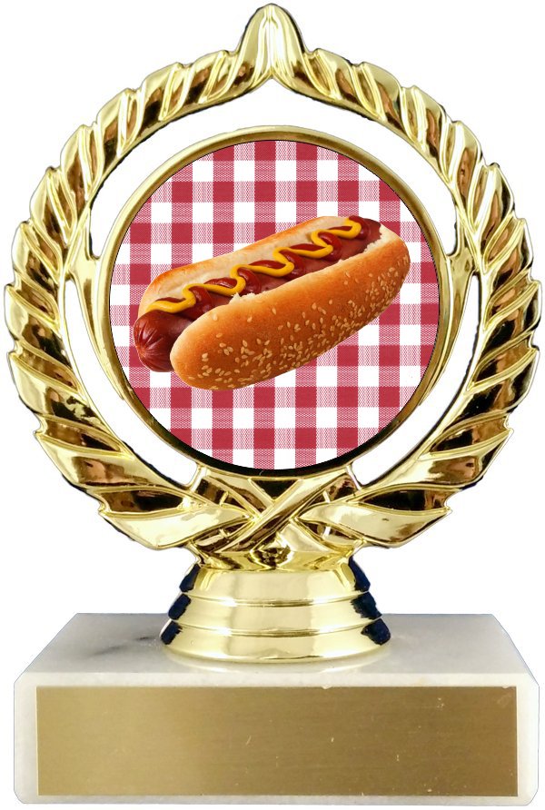 A trophy with a gold base and a red and white checkered background featuring an image of a hot dog on top.
